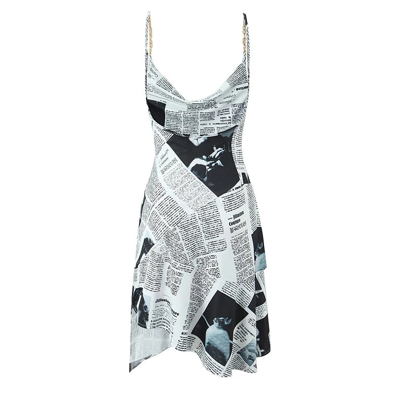 YENKYE New Women Newspaper Letter Print Irregular Hem Sling Dresses Fashion Backless Thin Straps With Chain Summer Sexy Dress